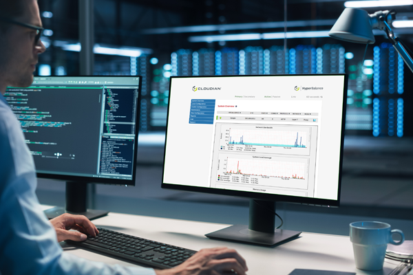 Man looking at screen showing Cloudian HyperBalance interface